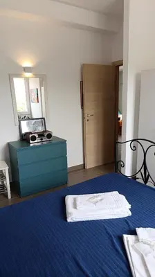 a bedroom with a blue bed and a blue dresser at Villa Casa di Franca - 700 meters from the sea Scopello in Castellammare del Golfo