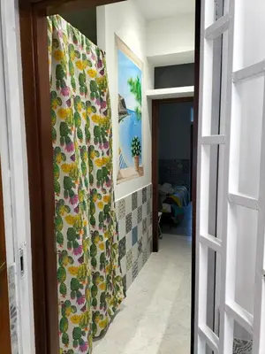 a hallway with a shower curtain in a room at La Loggia 34 in Palermo
