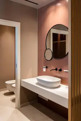 a bathroom with a sink and a mirror on the wall at Limen Wellness Hotel & Spa in Campofelice di Roccella