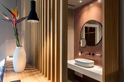 a bathroom with a white sink and a mirror at Limen Wellness Hotel & Spa in Campofelice di Roccella