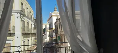 a view of a city from a window at BALLARHOUSE in Palermo