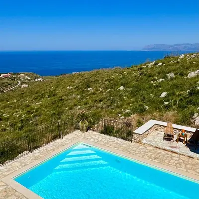 a swimming pool with a view of the ocean at Villa Felice - SEAVIEWS & PRIVATE POOL in Scopello