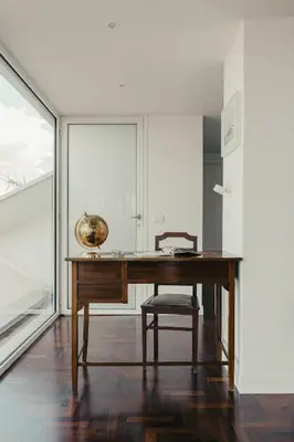 a wooden desk with a chair in a room at TOP OF THE PORT in Palermo