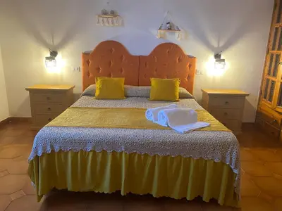 a bedroom with a bed with two towels on it at Villa Contrada Sauci in San Vito lo Capo
