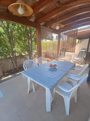 a blue table and chairs on a patio at SanVitoTour- Appartamento Smeraldo in San Vito lo Capo