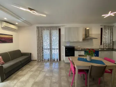 a living room with a couch and a table at Casa Diamante in San Vito lo Capo
