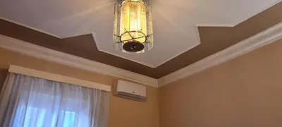 a chandelier hanging from a ceiling in a room at Appartamento centro in Palermo