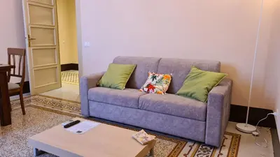 a living room with a couch and a coffee table at Appartamento centro in Palermo