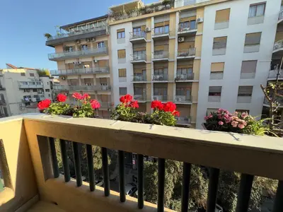 a balcony of a building with flowers on it at Appartamento centro in Palermo