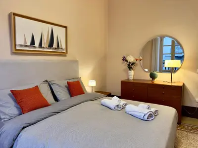a bedroom with a bed with two towels on it at Appartamento centro in Palermo
