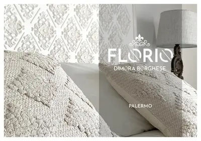 a picture of a bed with a white quilt at Dimora Borghese “Florio” in Palermo