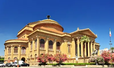 a large building with a dome on top of it at Massimo Luxury Rooms in Palermo