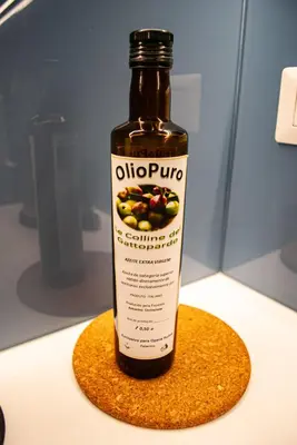 a bottle of olioprotein sitting on a table at Opera Suites - Norma in Palermo