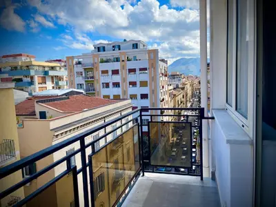 a balcony with a view of a city at 38 HOUSE in Palermo