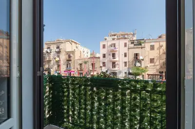 a view of a city from a window at Mille91 Apartment in Palermo