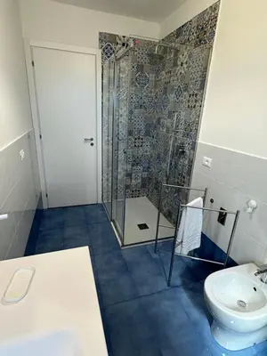 a bathroom with a shower and a sink and a toilet at Villa FIORENZA in Castellammare del Golfo
