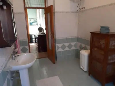 a bathroom with a sink and a toilet at casa di Enrico in Palermo