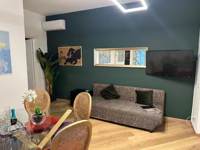 a living room with a couch and a table at Flat with Jacuzzi - Casa Pia in Mondello