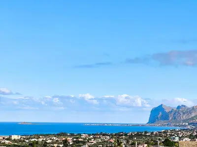 a view of a city and the ocean and mountains at Piante del Principe Apartments in Carini