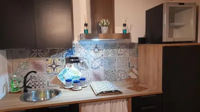 a kitchen counter with a sink and a keyboard at Casa vacanza Gio in Palermo