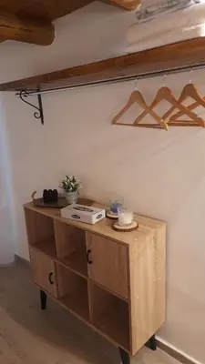 a room with a wooden desk with a shelf at Casa vacanza Gio in Palermo