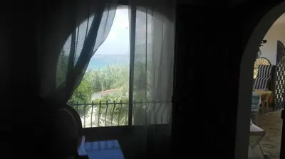 a room with a window with a view of the ocean at Villa Mare Ercole Luxury in Trappeto