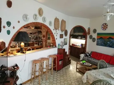 a living room with a couch and a table at Villa Mare Ercole Luxury in Trappeto