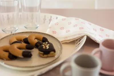 two donuts on a plate on a table at Pittalumari Makari in Macari