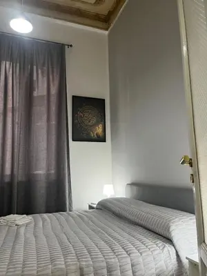 a bedroom with a bed and a window at SPYDA in Palermo