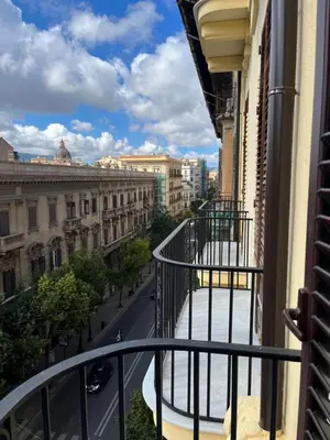 a balcony of a building with a view of a street at SPYDA in Palermo