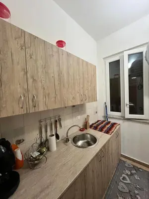 a kitchen counter with a sink and a window at House del Corso Calatafimi in Palermo