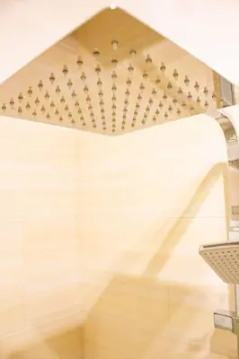 a ceiling in a room with a table and a chair at M'Place - Mondello Residence in Palermo