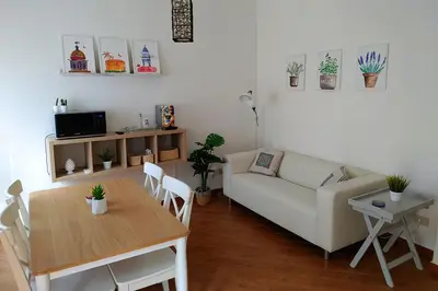 a living room with a couch and a table at Appartamento Ai Murales in Palermo
