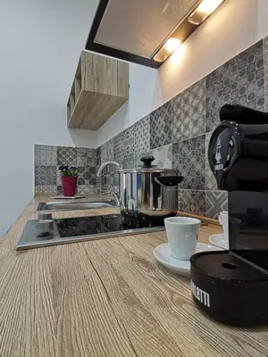 a kitchen with a counter top with a pot on a stove at CasAnna in Castellammare del Golfo