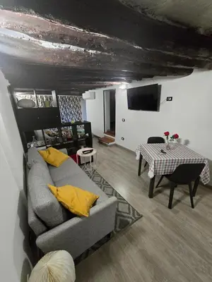 a living room with a couch and a table at Virginia House 3 in Palermo