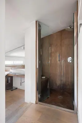 a bathroom with a shower with a glass door at La Cala Terrace by Domusicily in Palermo