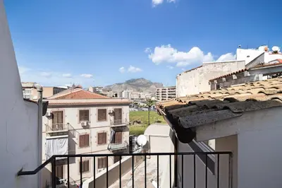 a view from the balcony of a building at La Cala Terrace by Domusicily in Palermo
