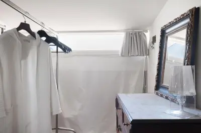 a dressing room with a mirror and a table at La Cala Terrace by Domusicily in Palermo