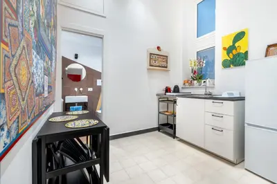 a kitchen with a counter with plates on it at CASA FLORIO in Palermo