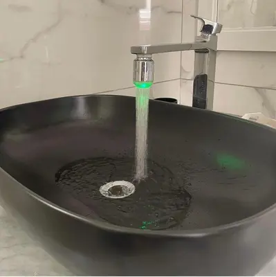 a sink with water coming out of a faucet at RC SUITE TERMINI IMERESE in Termini Imerese