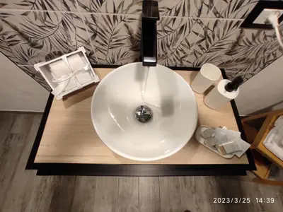 a white sink on top of a wooden table at Holiday Home GaribaldiOM Palermo Centro Storico! in Palermo