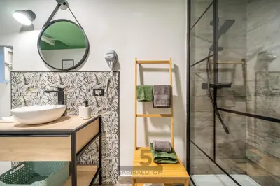 a bathroom with a sink and a shower at Holiday Home GaribaldiOM Palermo Centro Storico! in Palermo