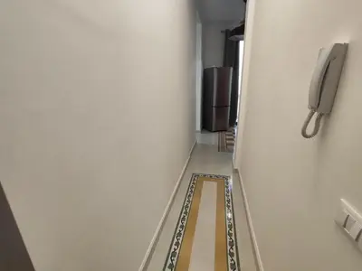 a hallway with a phone in a room at Palazzo Orangea 2 piano in Bagheria