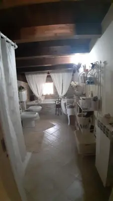 a bathroom with toilets in a room with a ceiling at Appartamento uso turistico Villa Barbara in Carini
