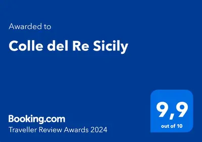 a blue sign with the words called delfi re entity at Colle del Re Sicily in Partinico