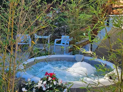a hot tub in the middle of a garden at villla chiazzese in Palermo
