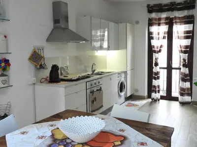 a kitchen with a table with a bowl on it at A Casa di Eli Apartment in Palermo