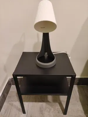 a table with a lamp on top of it at Room Sixty One in Palermo