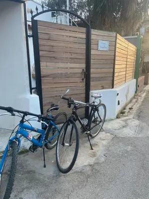 two bikes are parked next to a building at Marea in Palermo