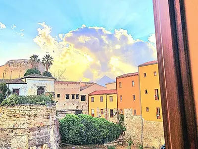 a view of a city from a window at La Baronessa in Palermo